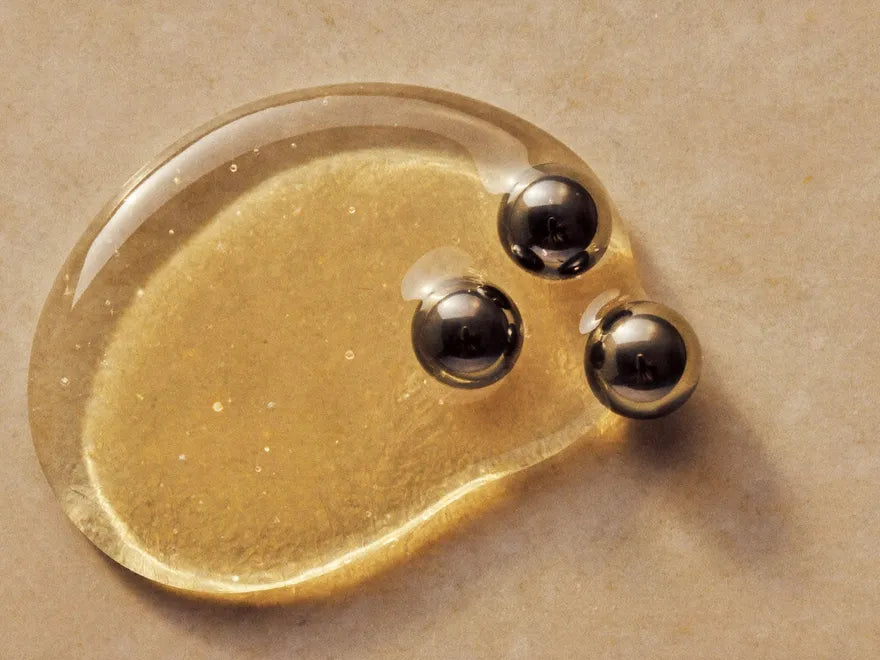 A drop of the serum beside caviar pearls